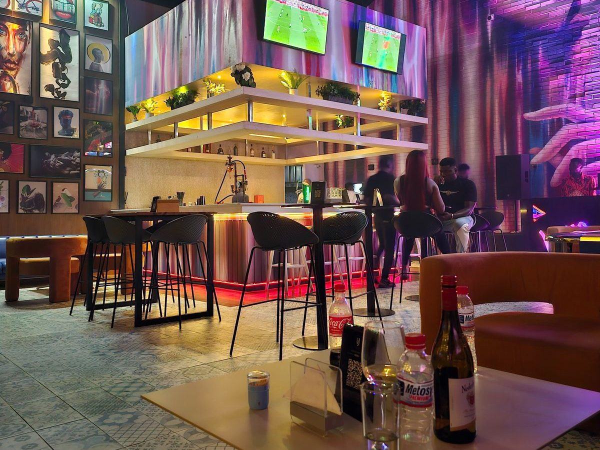 UJ inside The Playground — bar and mural wall